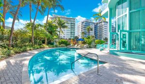 Heated swimming pool and tropical gardens at 6000 Indian Creek