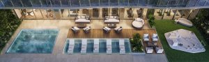 Oceanfront infinity pools and poolside bar at 57 Ocean Miami Beach