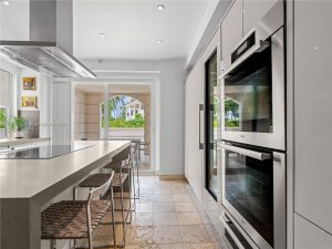 Modern gourmet kitchen inside an Oceanside Fisher Island condo
