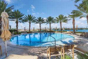 Resort-style swimming pool and amenities at ICON South Beach Condo
