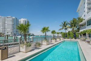 Luxury infinity pool overlooking Biscayne Bay at Capri South Beach