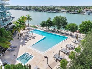 Luxury amenities and waterfront pool deck at Peloro Miami Beach