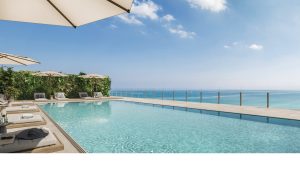 The expansive rooftop pool and sundeck at Ocean House Surfside